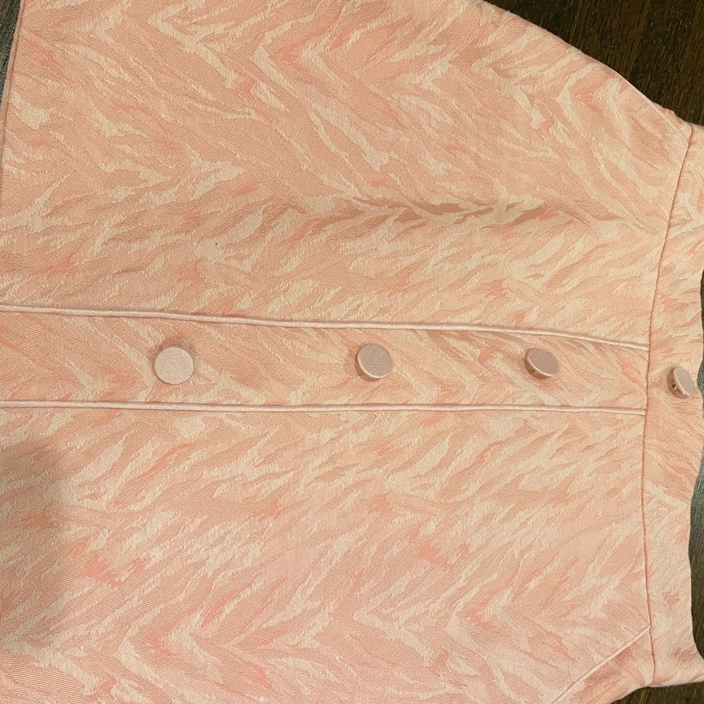Pink zebra style mini skirt. Had deep pockets with fake buttons